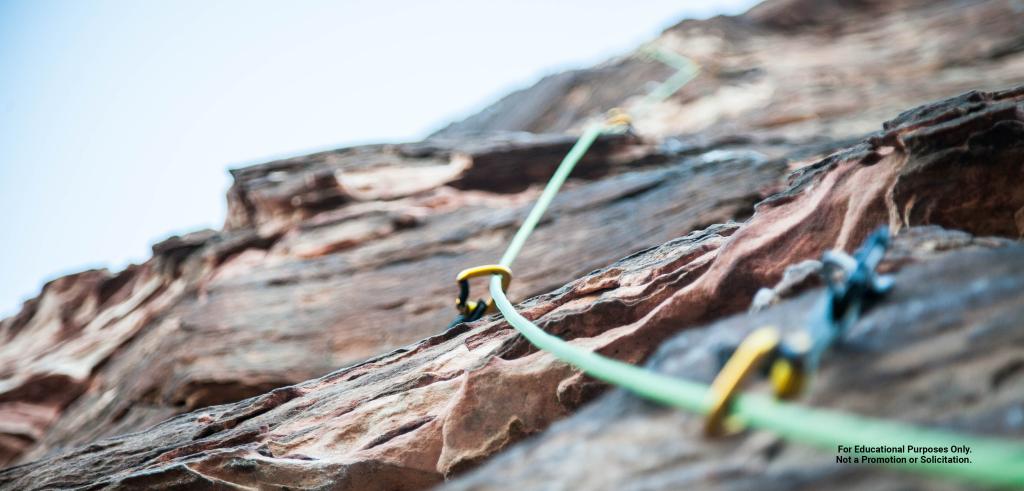 rock climbing rope attached to a cliff